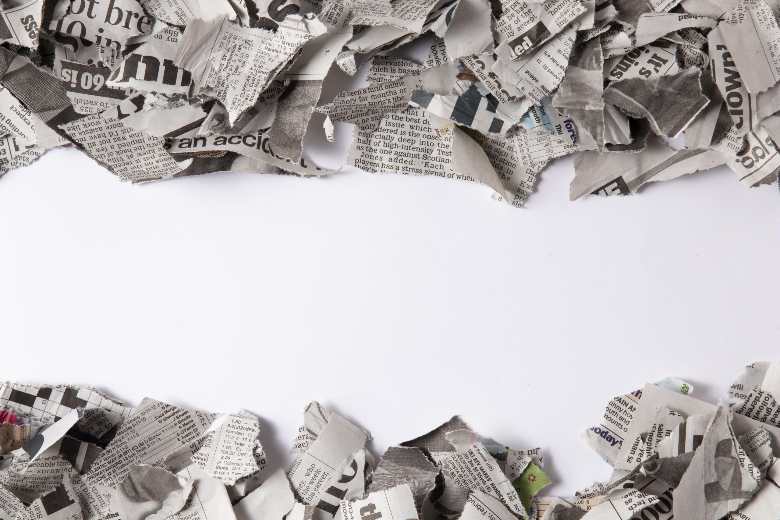 top-view-newspaper-pieces-assortment-min